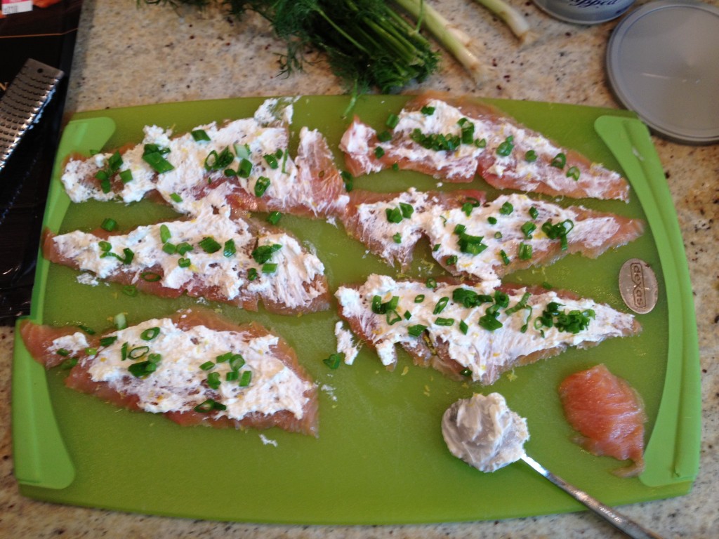 sliced green onions added to salmon