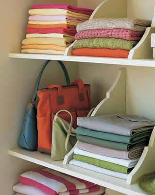 Beautifully organized closet shelves with dividers.