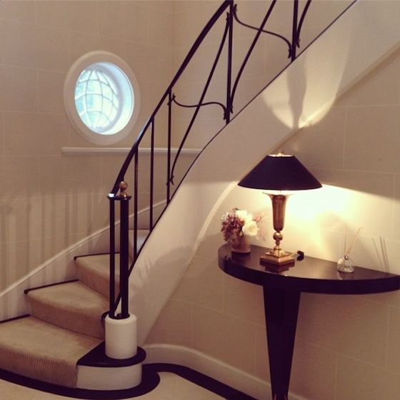 Curved Staircase with Wrought Iron Rail