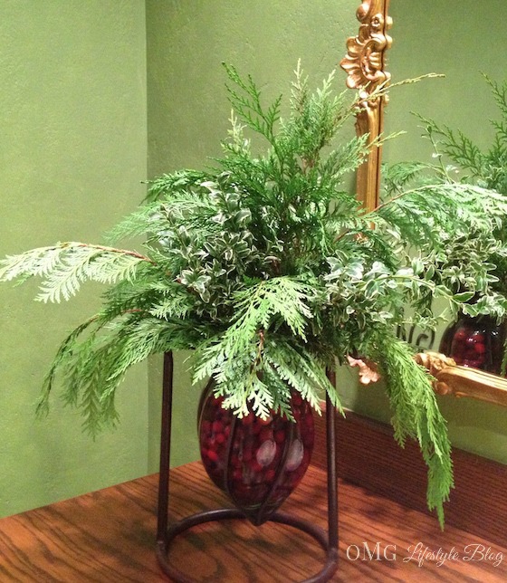 Fill a vase with leftover evergreen trimmings from your holiday decorating; add cranberries to the water for a festive touch.