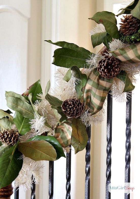 Pretty Christmas Staircases | Gingham and magnolia leaves make this Christmas staircase a little less formal.