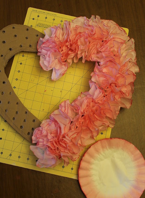 This wreath was made from coffee filters! | Read the post for more Valentine's Day Party Decorations