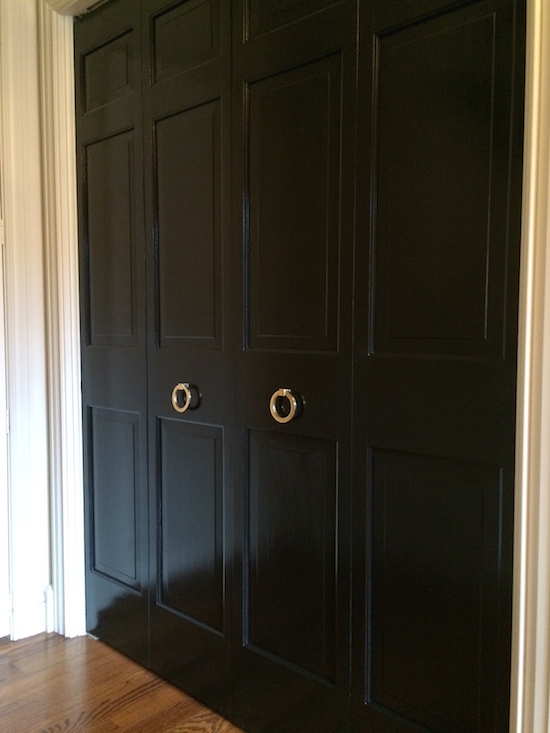 Black doors with brass rings