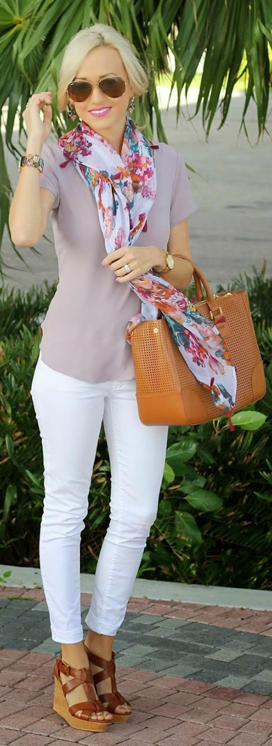 A floral scarf adds a pop of color to this white jean and blush top combo.