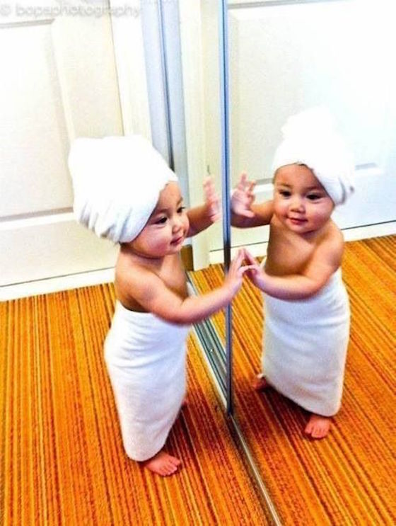 Baby Pictures that will Make You Smile - Child discovers herself in the mirror