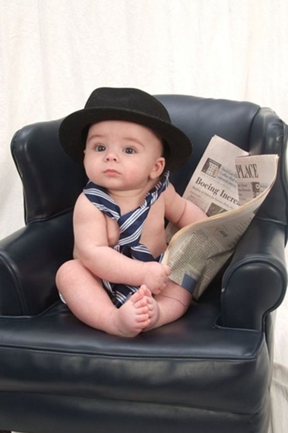Little man reading the paper