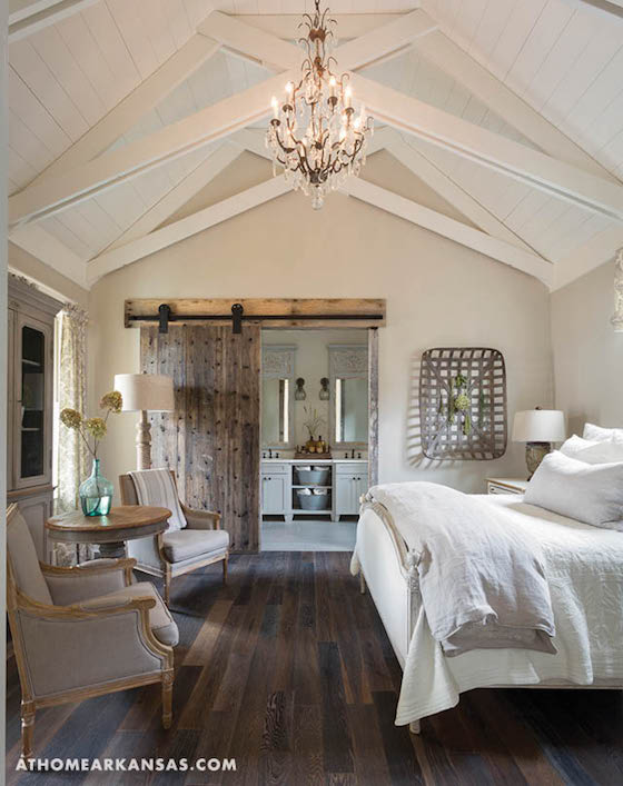 Gorgeous neutral bedroom with cathedral ceiling
