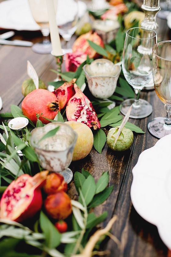 No vases needed - this unique centerpiece includes Pomegranates both whole and sliced open and other winter fruits.  Add greenery and votive candles.  Stunning!