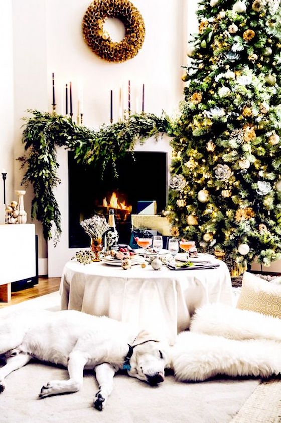Christmas Mantels | This contemporary fireplace mantel with green garland swag for Christmas