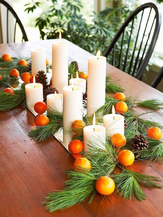 Use greenery, fruit and pine cones as a centerpiece for the holiday season