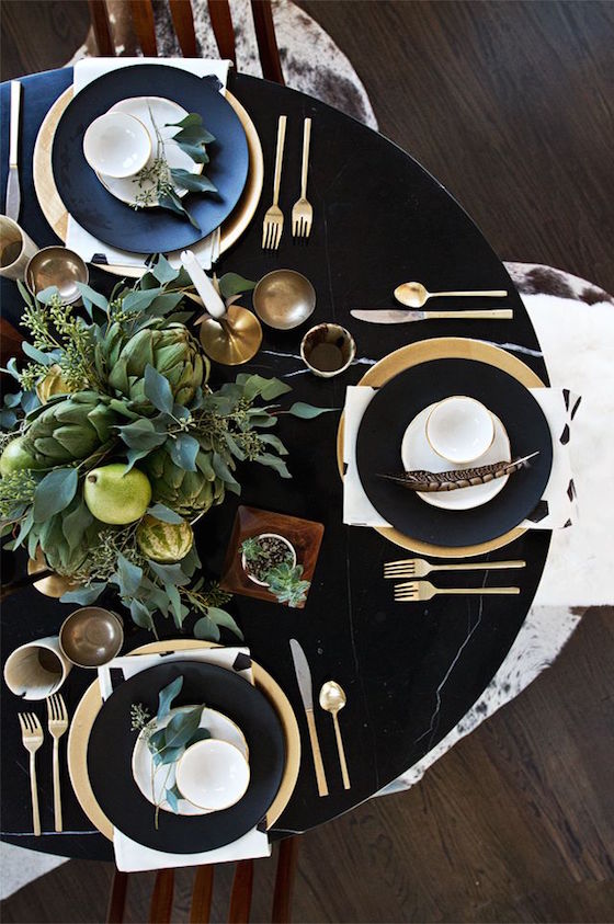 Love this dark tablecloth with the gold accessories