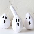 Gourds painted as ghosts for Halloween