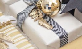 Add an ornament to plain gift wrap to make it holiday festive