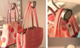 Use shower curtain hooks to hang purses in a closet